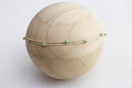 Bead tieback