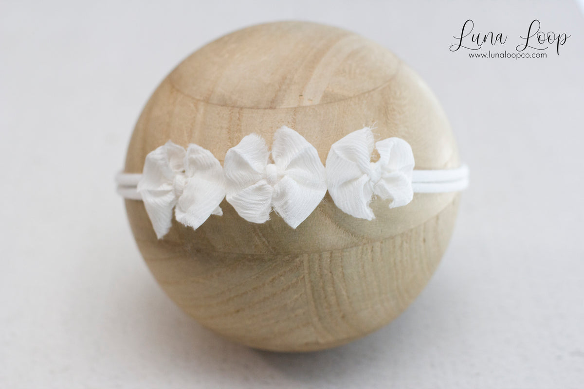 White | trio bow